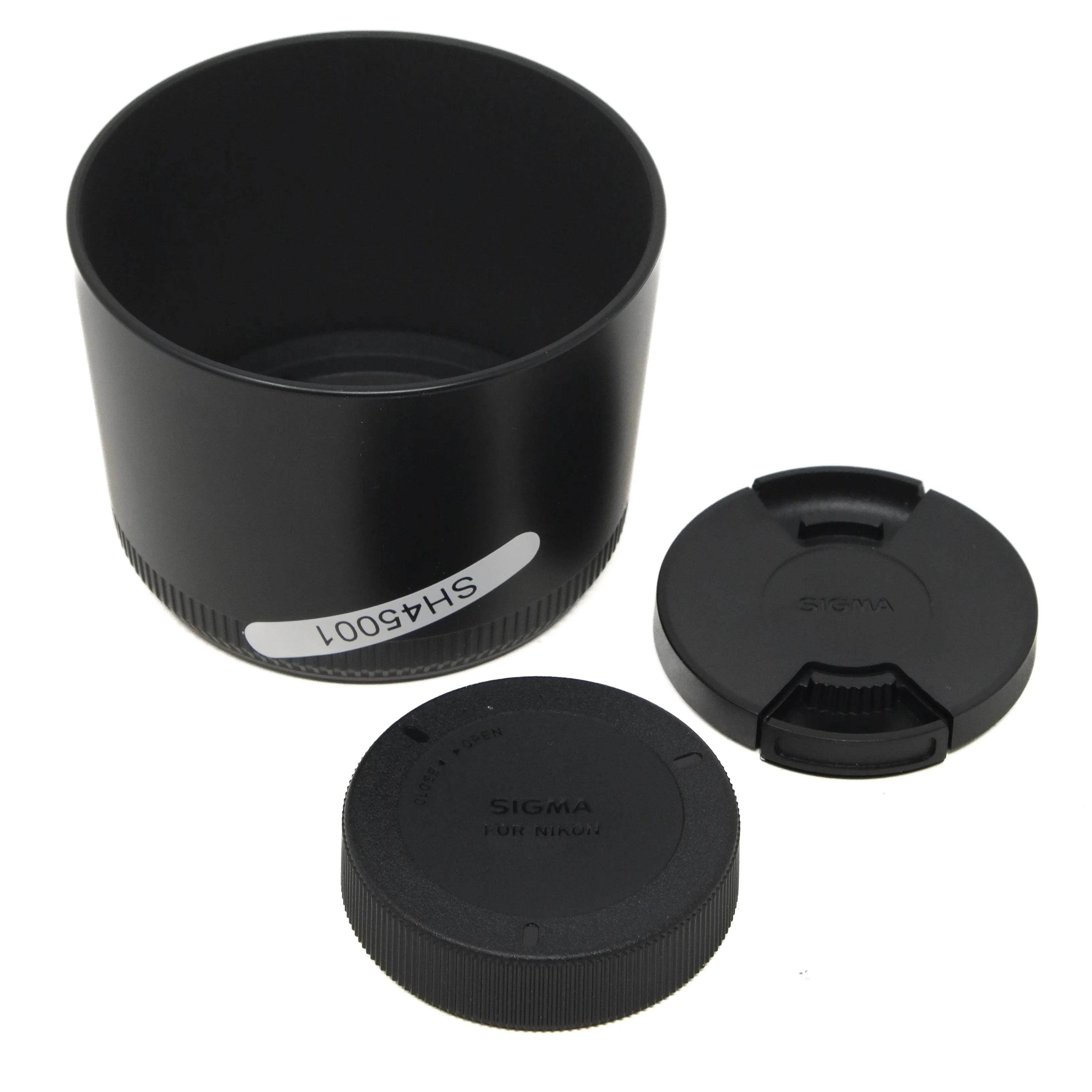 Black camera lens hood and caps on a white background