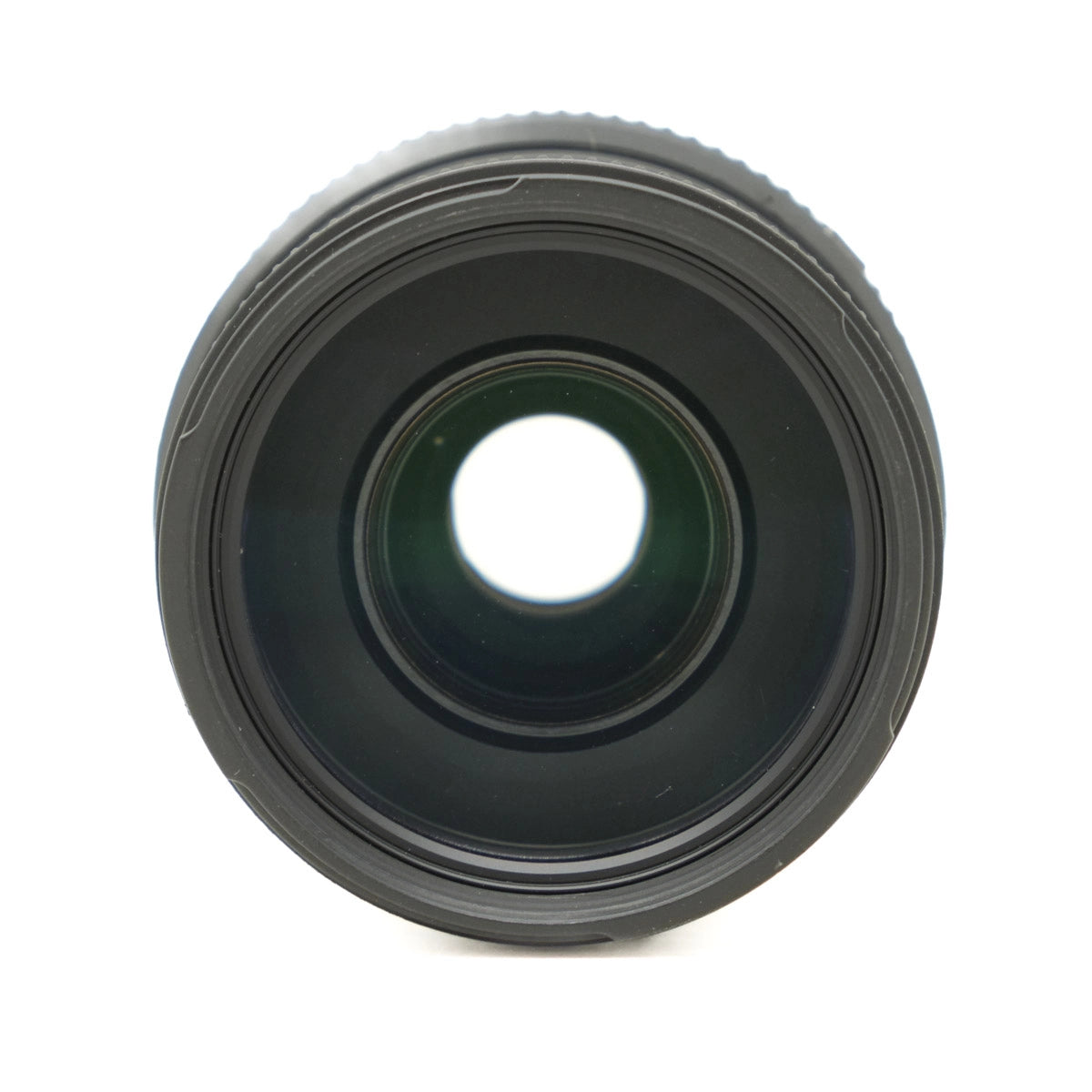 Black camera lens on a white background