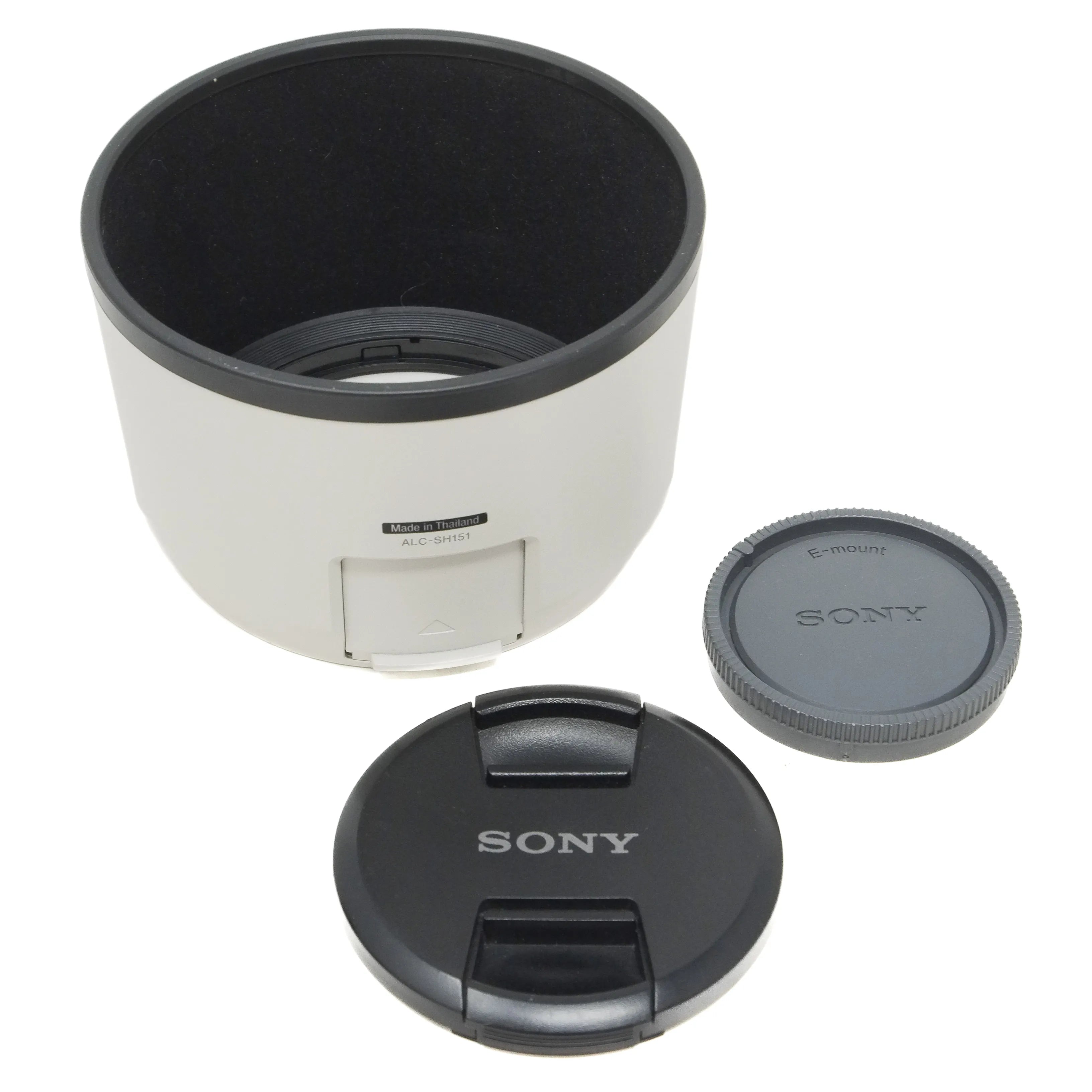 Camera lens hood and caps on a white background