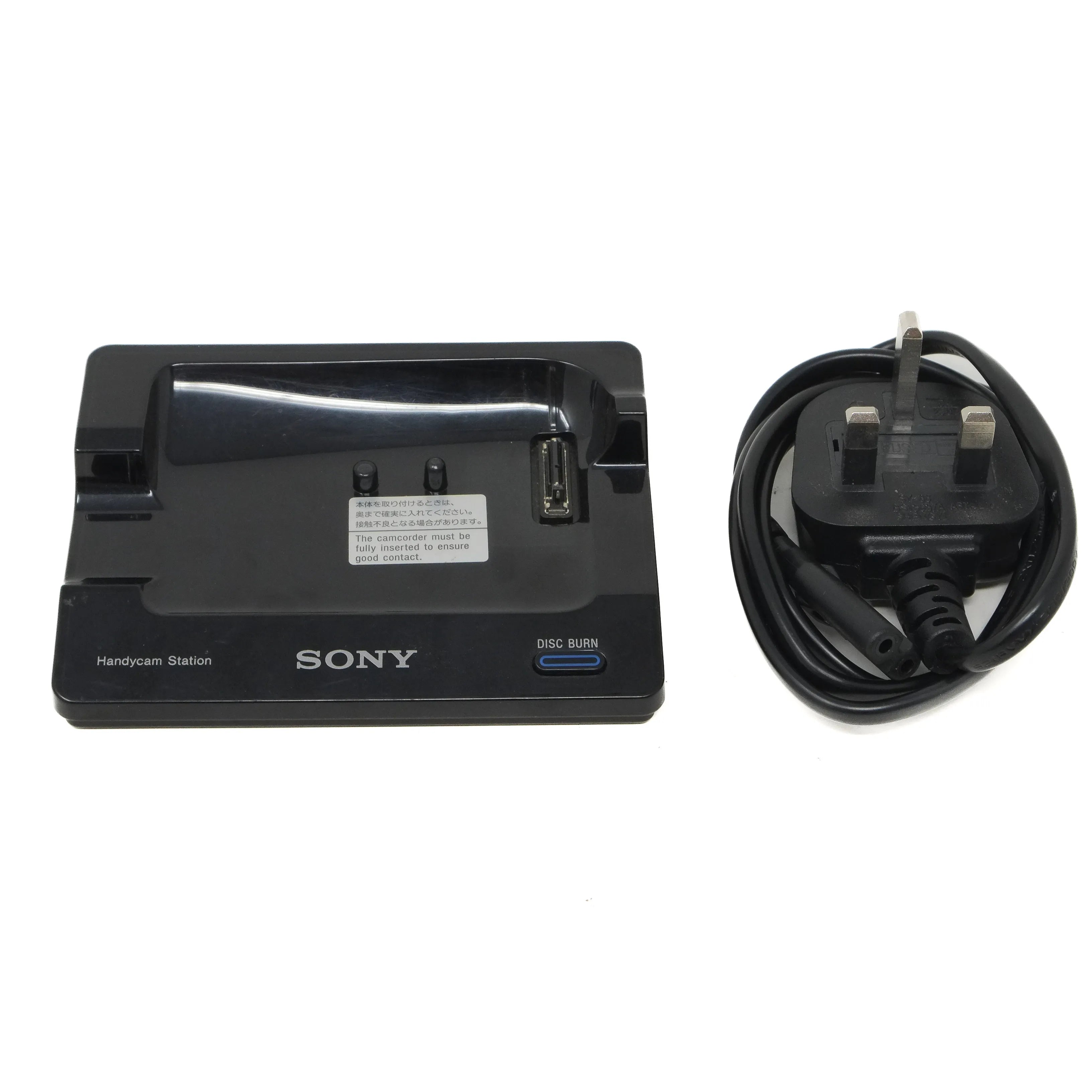 Sony charging dock and power cable on a white background