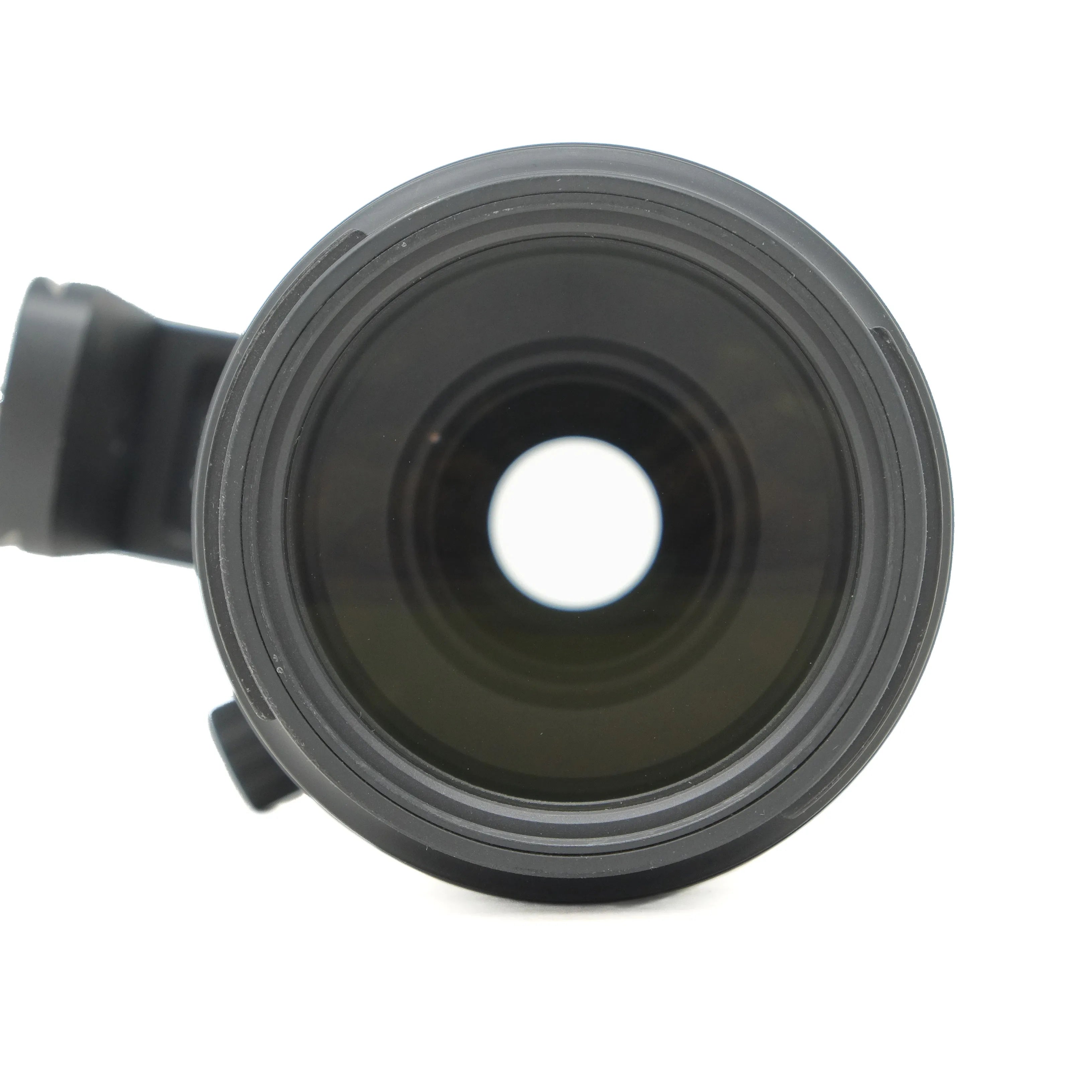 Close-up of a camera lens on a white background
