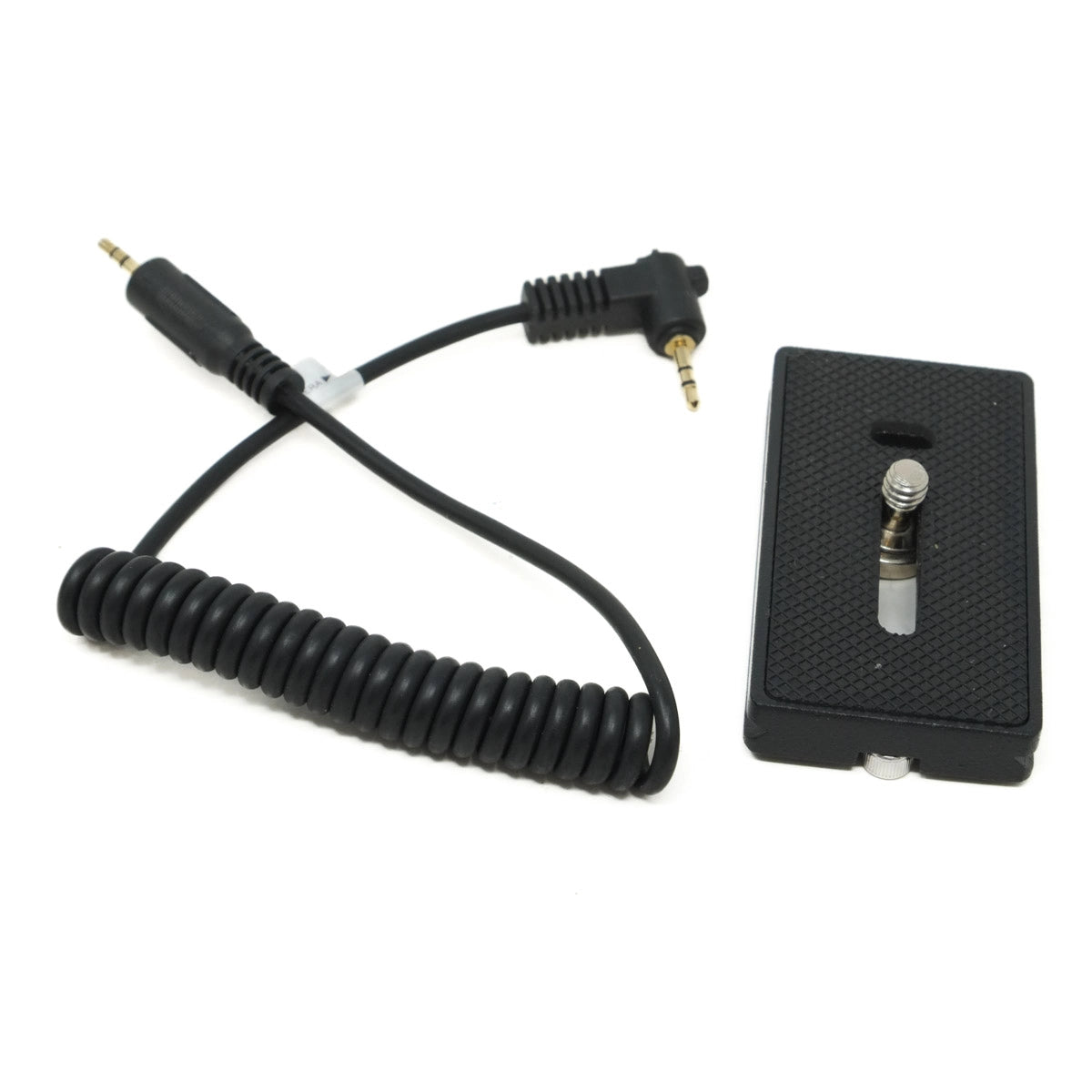 Black coiled cable and camera accessory on a white background