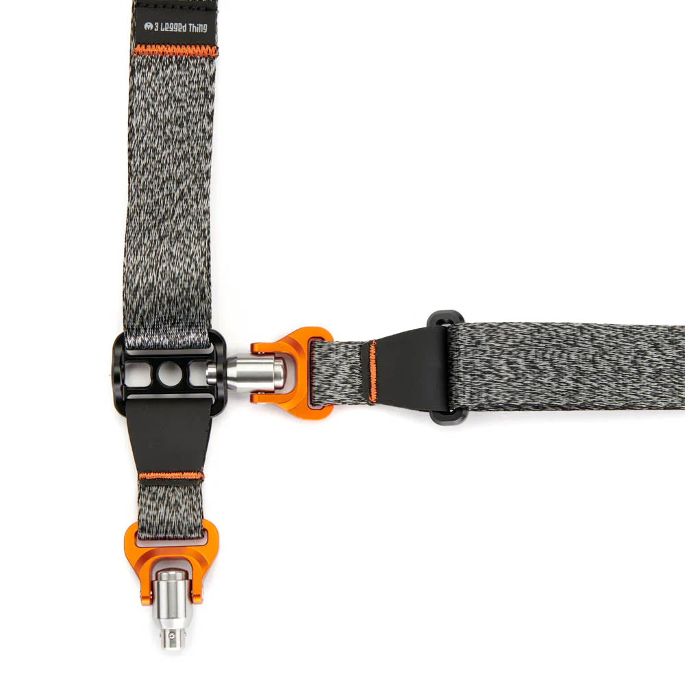 Gray and orange strap with metal clasp on a white background