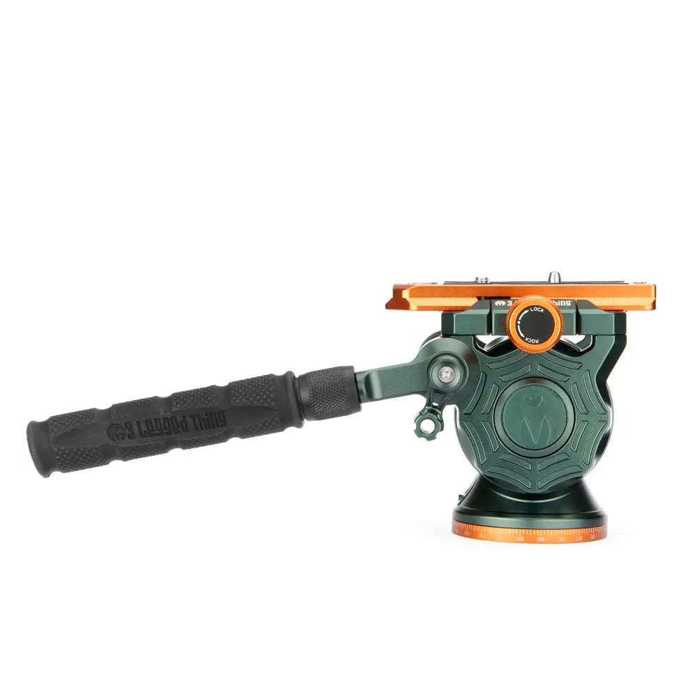 Green and orange tool with a handle on a white background