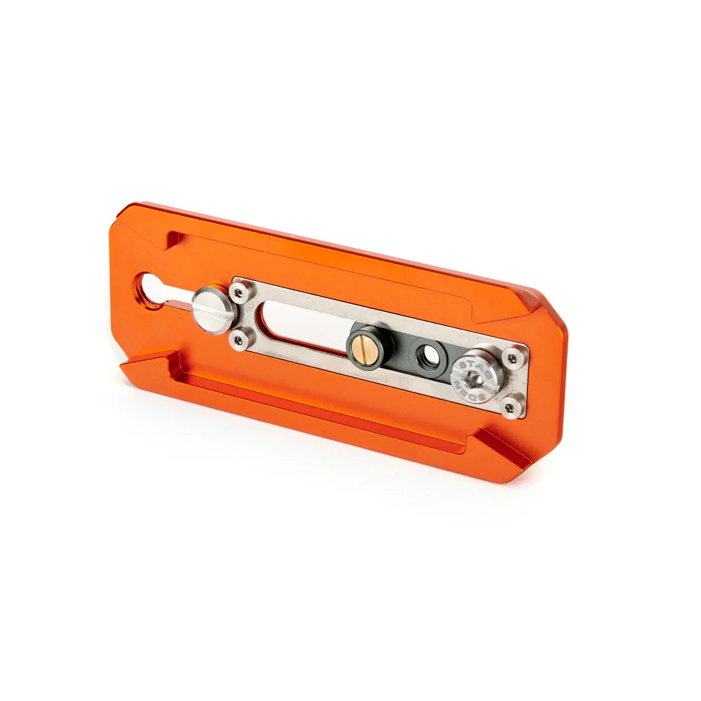 Orange metal tripod plate with black textured surface on a white background