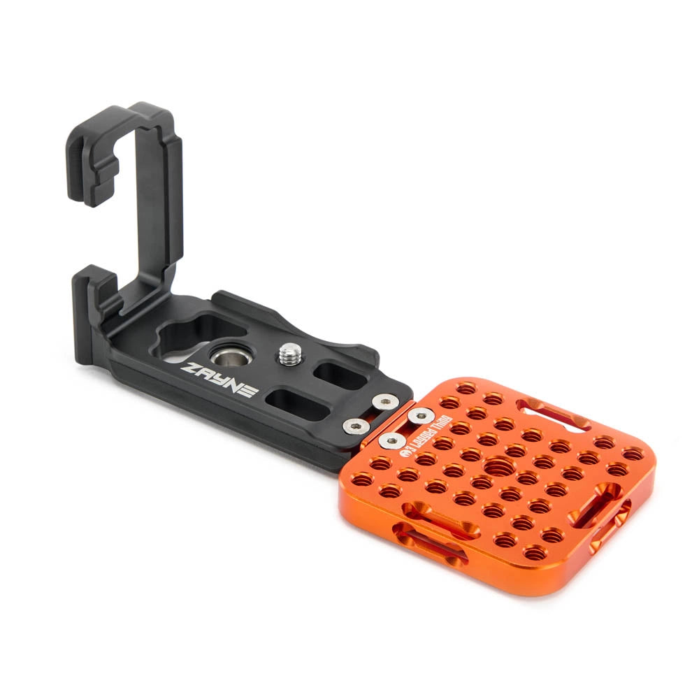 Camera accessory with black and orange components on a white background