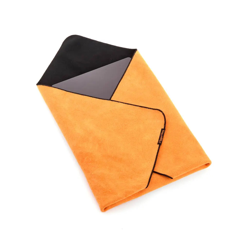Orange towel with black corner on a white background