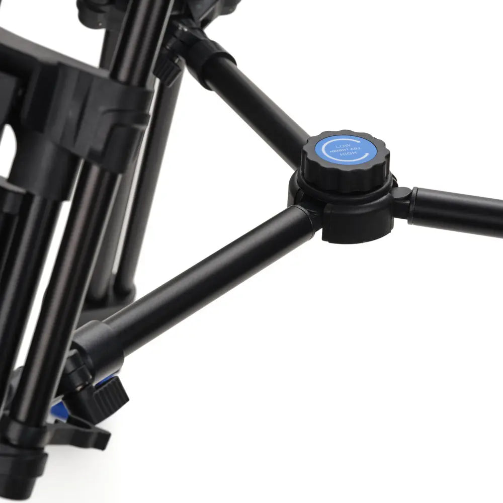 Black adjustable tripod on a white background