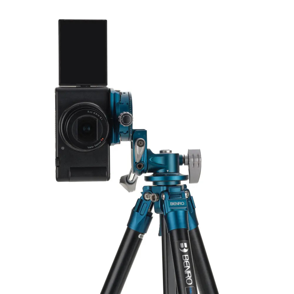 Camera with a microphone on a tripod against a white background