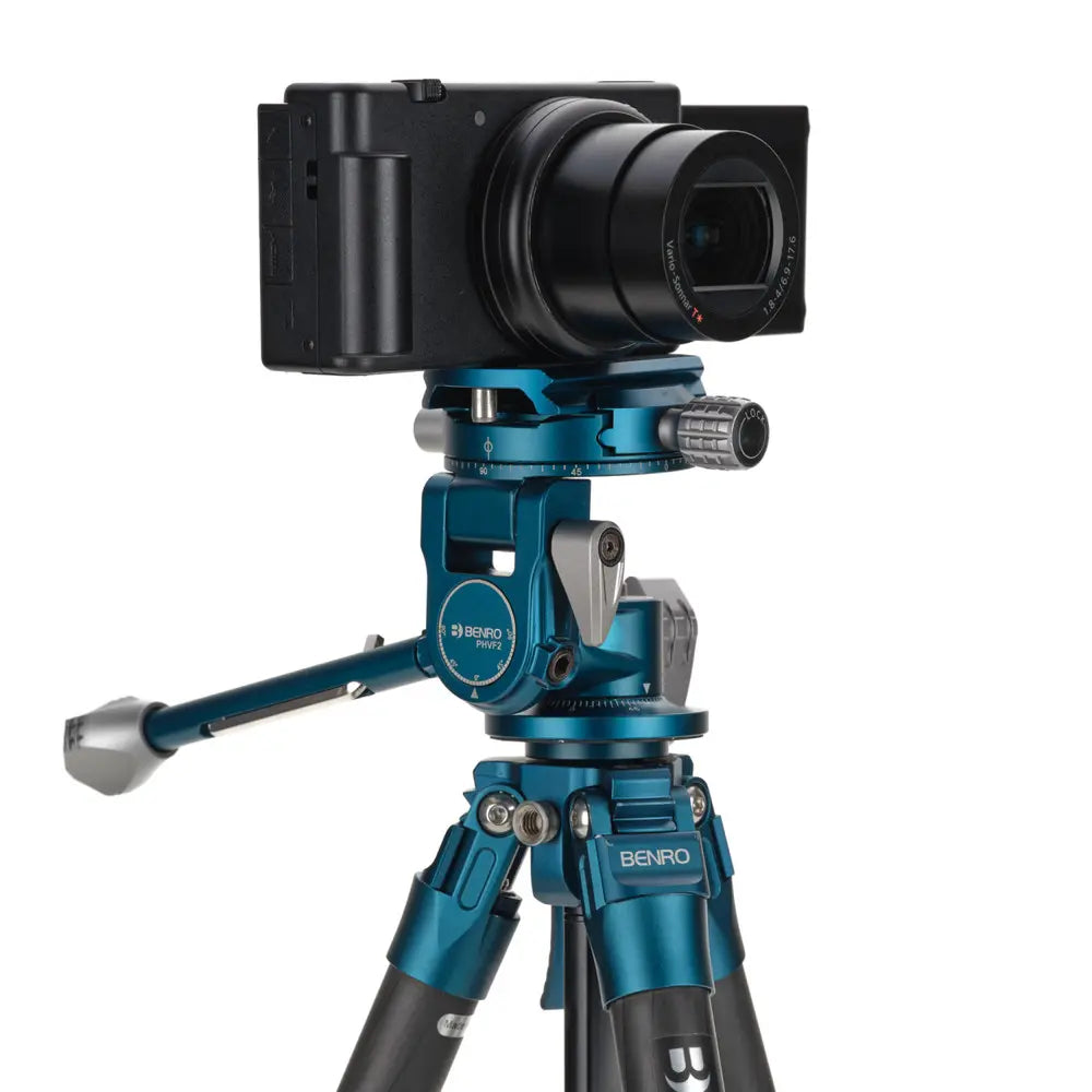 Camera on a Benro tripod with a white background