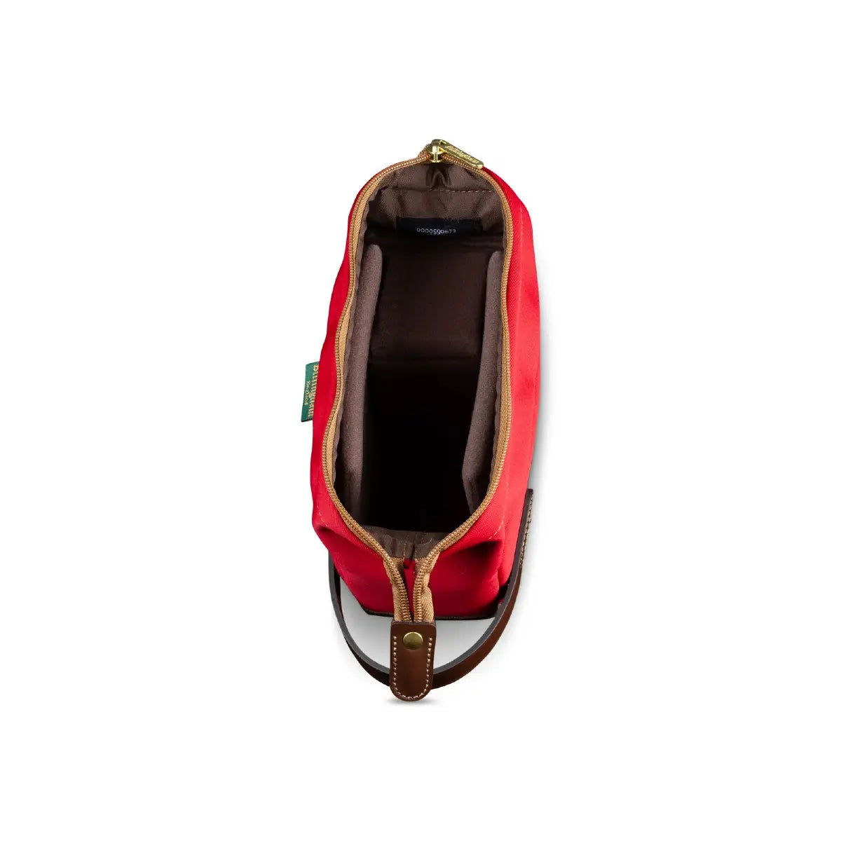 Red toiletry bag with brown interior on a white background