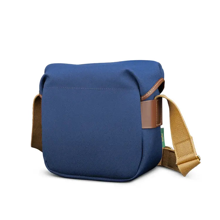 Blue bag with brown strap on a white background