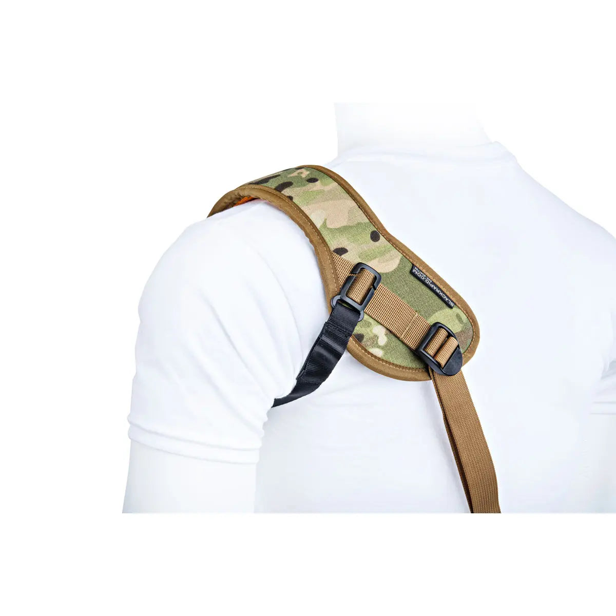 Camouflage shoulder holster on a person wearing a white shirt
