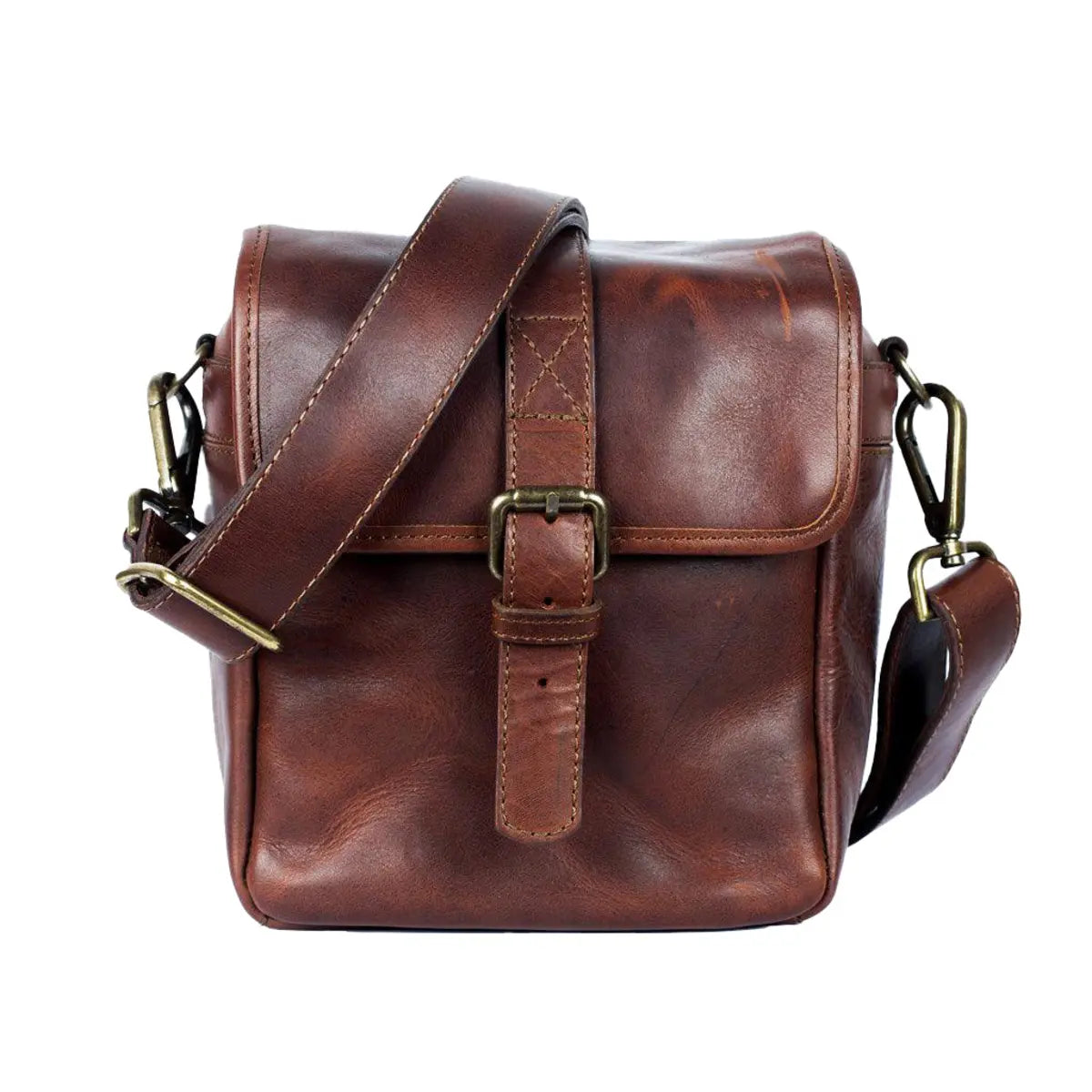 Brown leather satchel bag with gold buckles on a white background