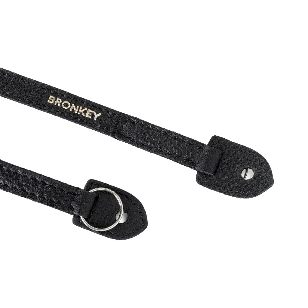 Black leather strap with bronkey branding on a white background