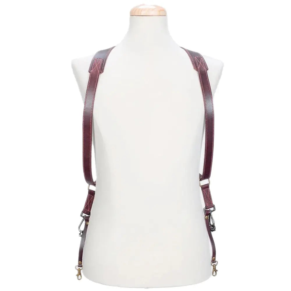 Brown leather suspenders on a mannequin against a white background