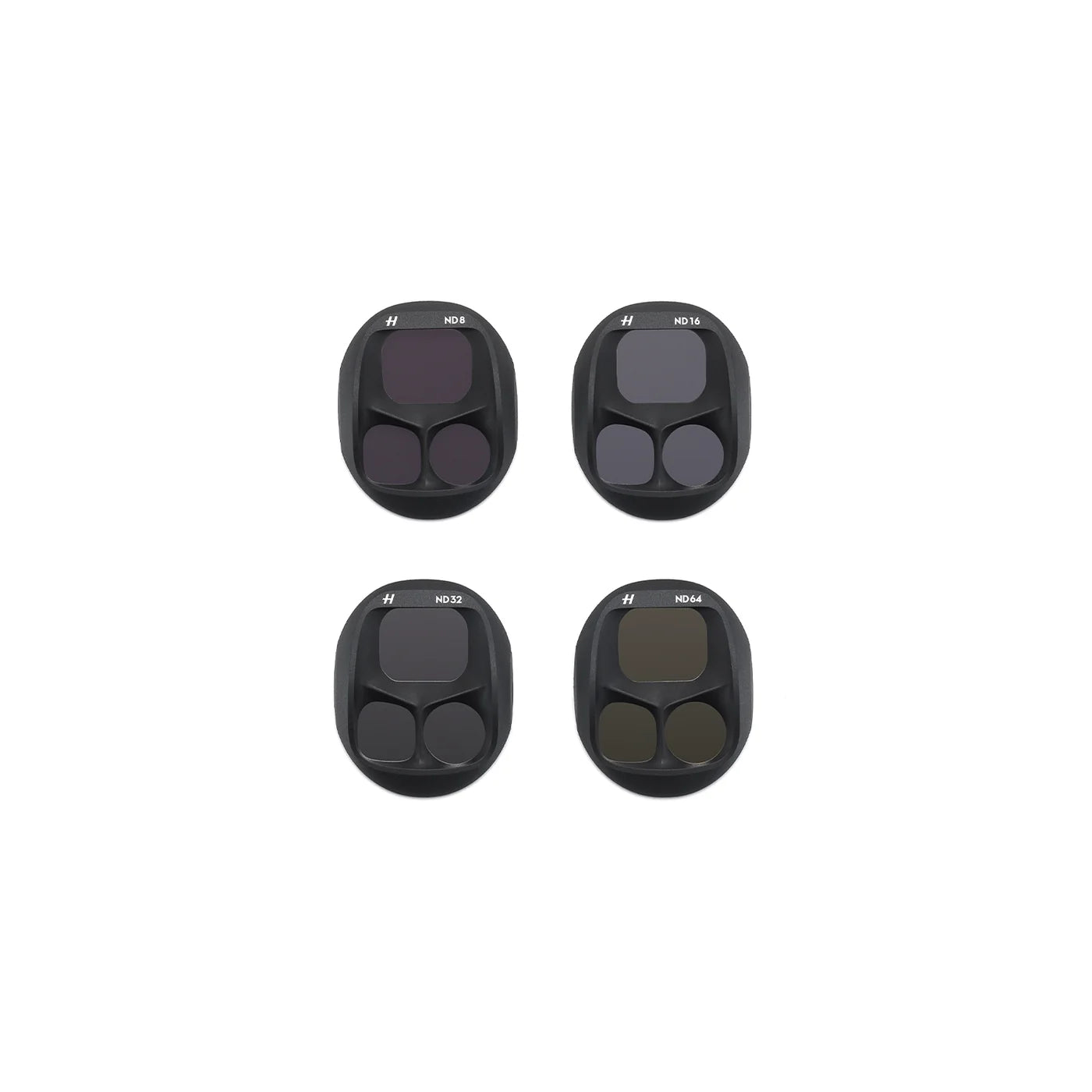Four black camera lens filters on a white background