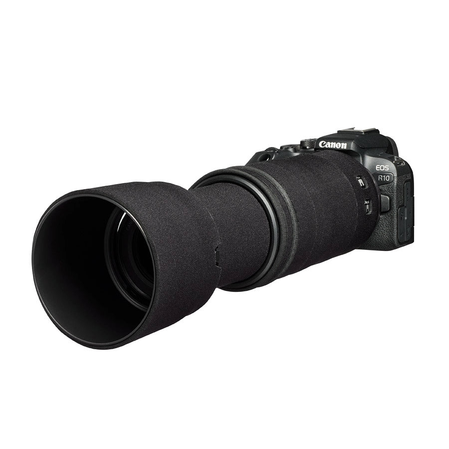 Canon camera with a large lens on a white background