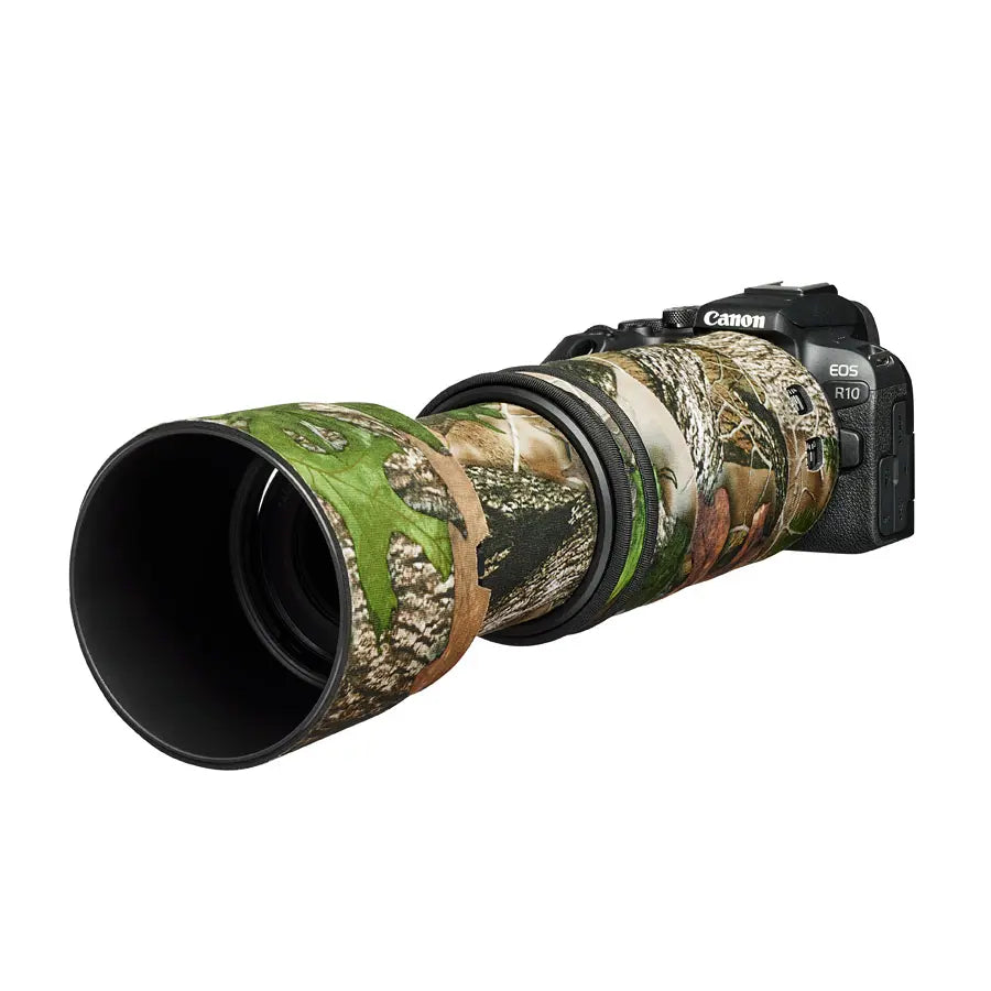 Canon camera with a camouflaged lens on a white background