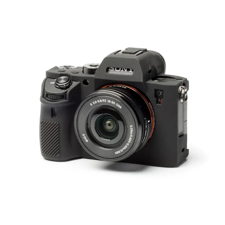 Black camera with lens on a white background