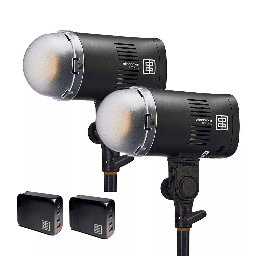 Two studio lights with stands and power supplies on a white background