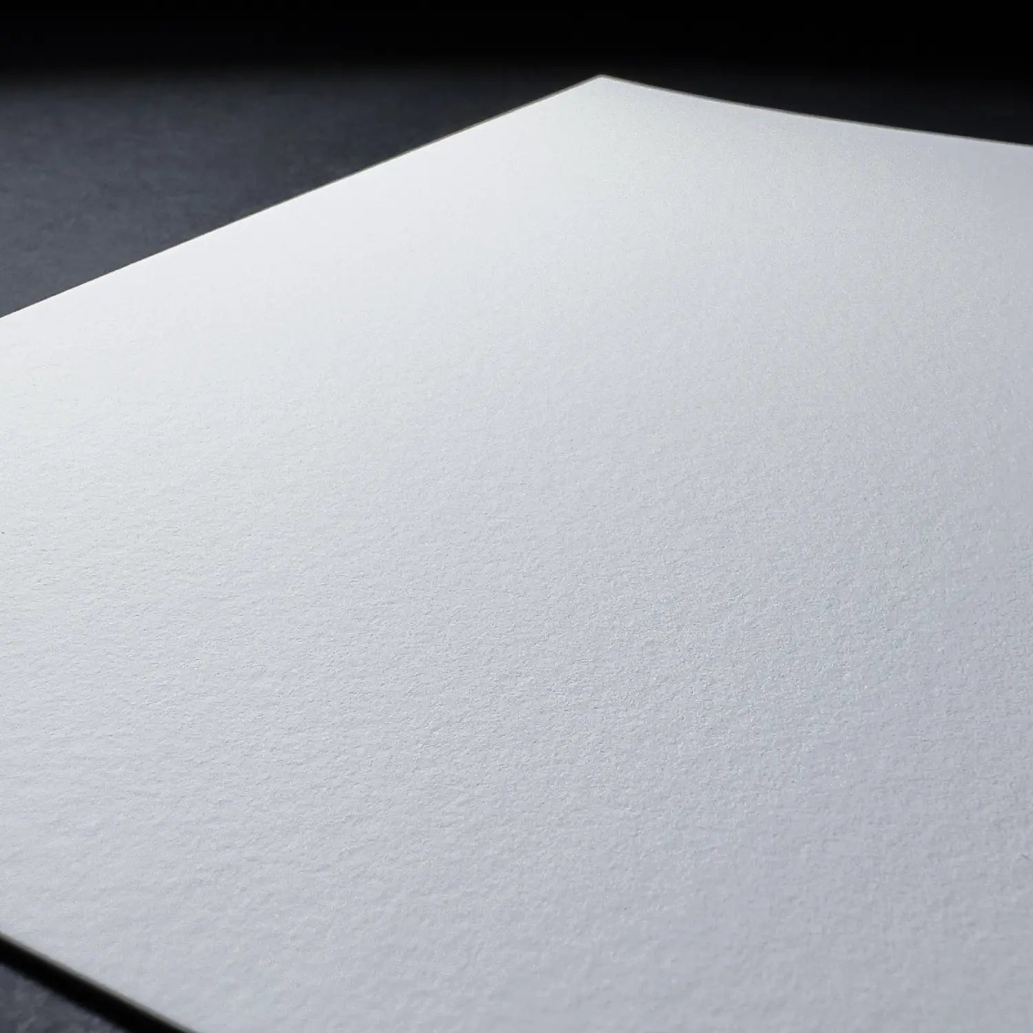White paper sheet on a black background