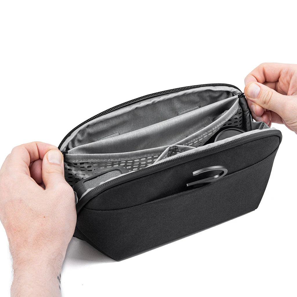 Peak Design Wash Pouch V2 Small – Sage top angle of hands closing pouch