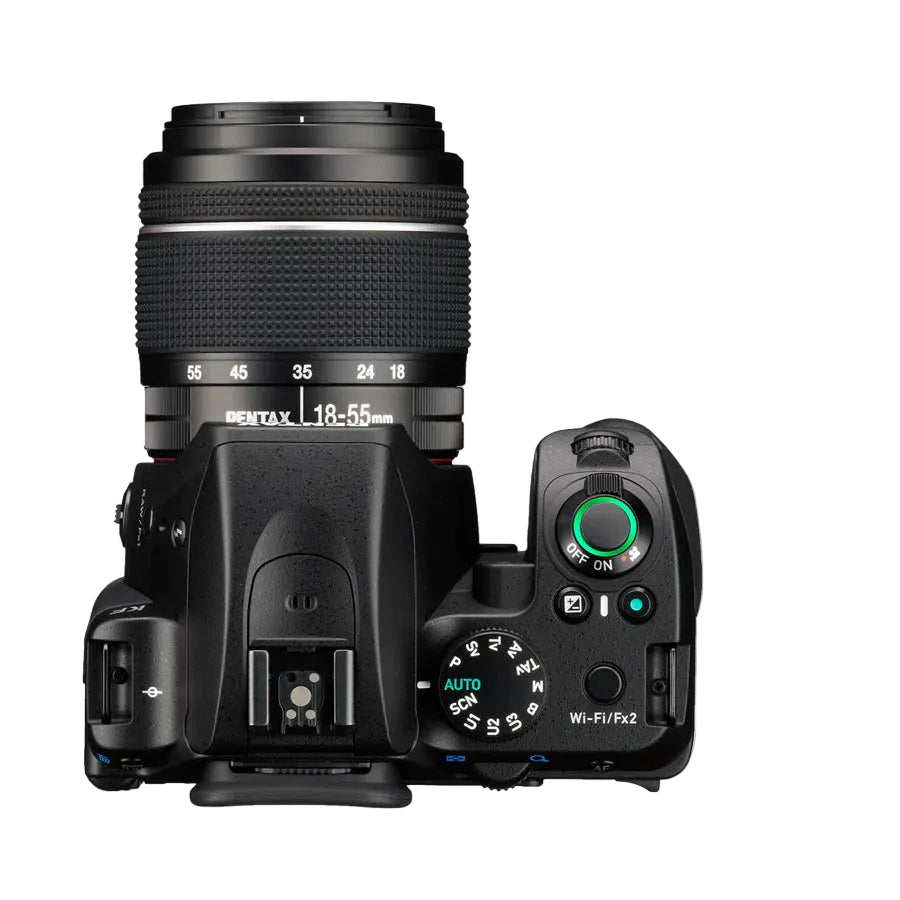 Camera body with lens on a light gray background