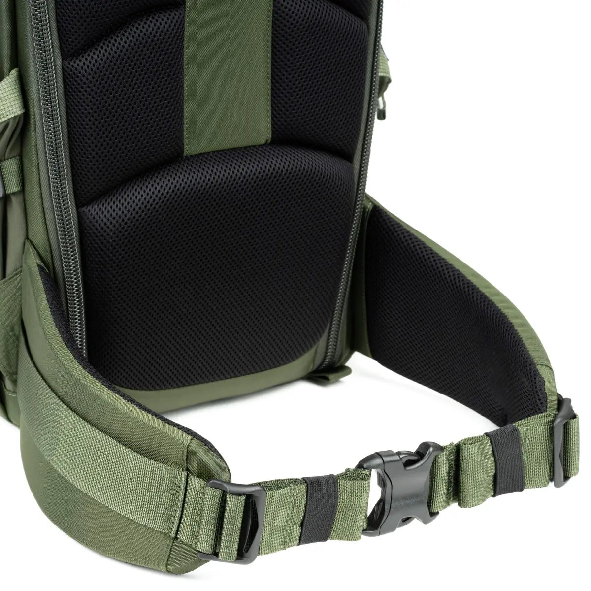 Close-up of a green backpack with a black interior on a white background