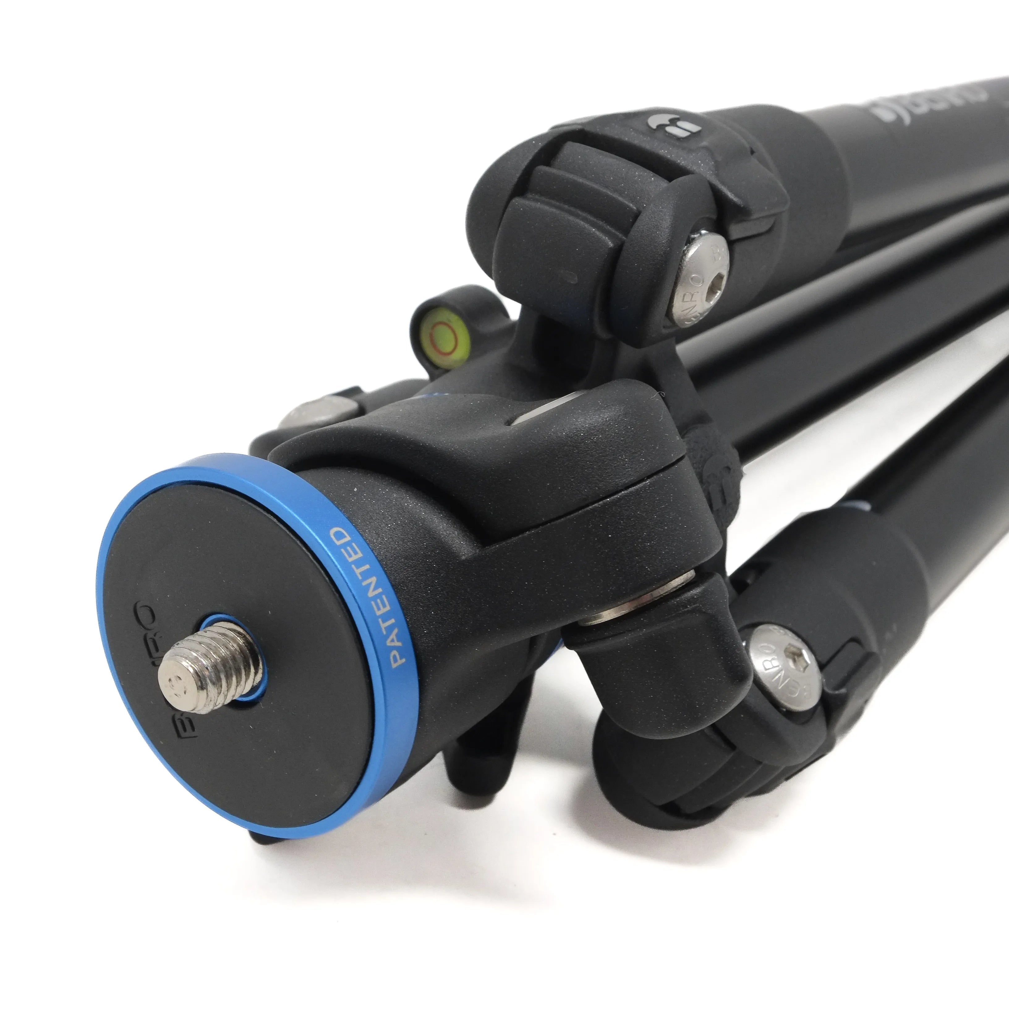 Close-up of a camera tripod with a white background
