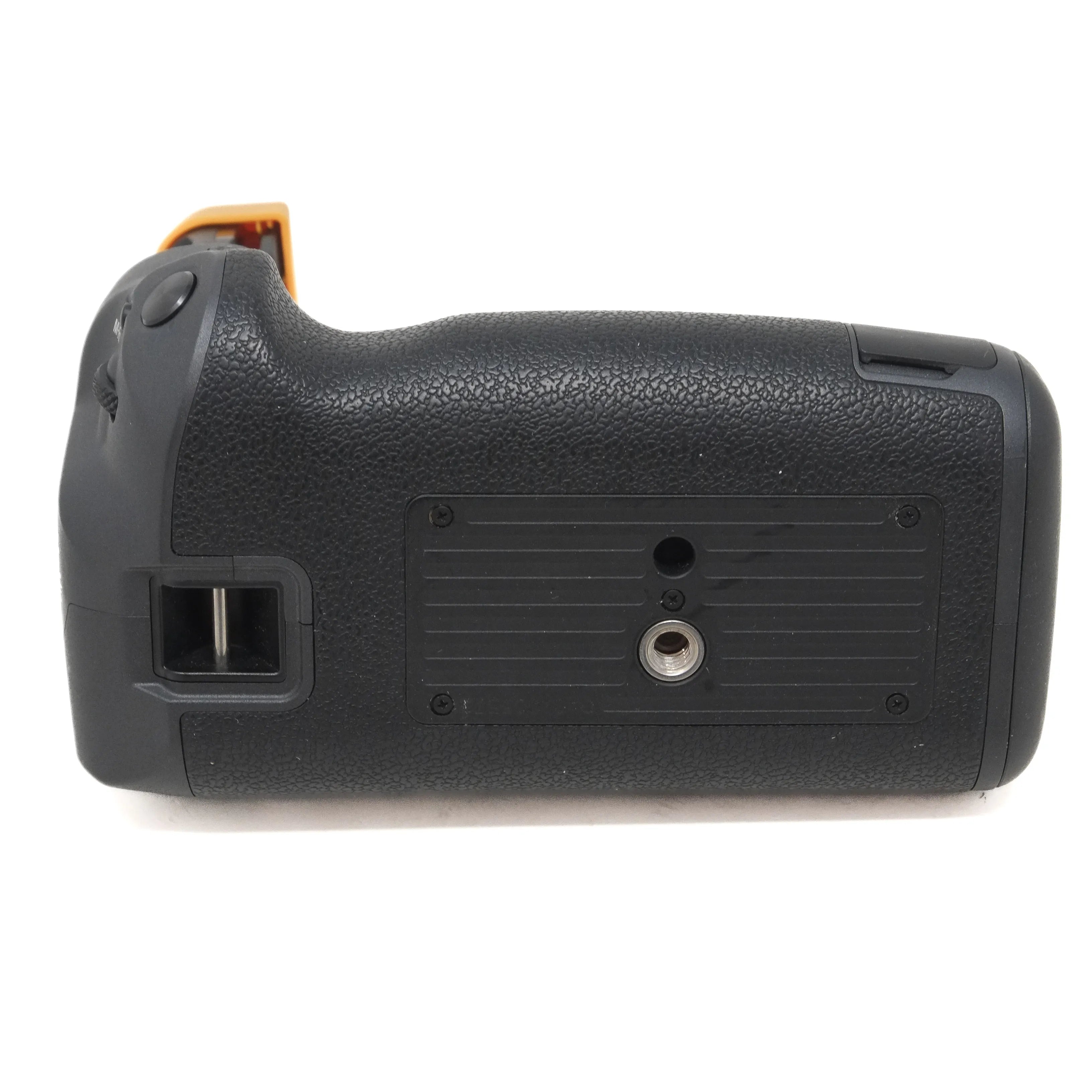 Black camera battery grip on a white background
