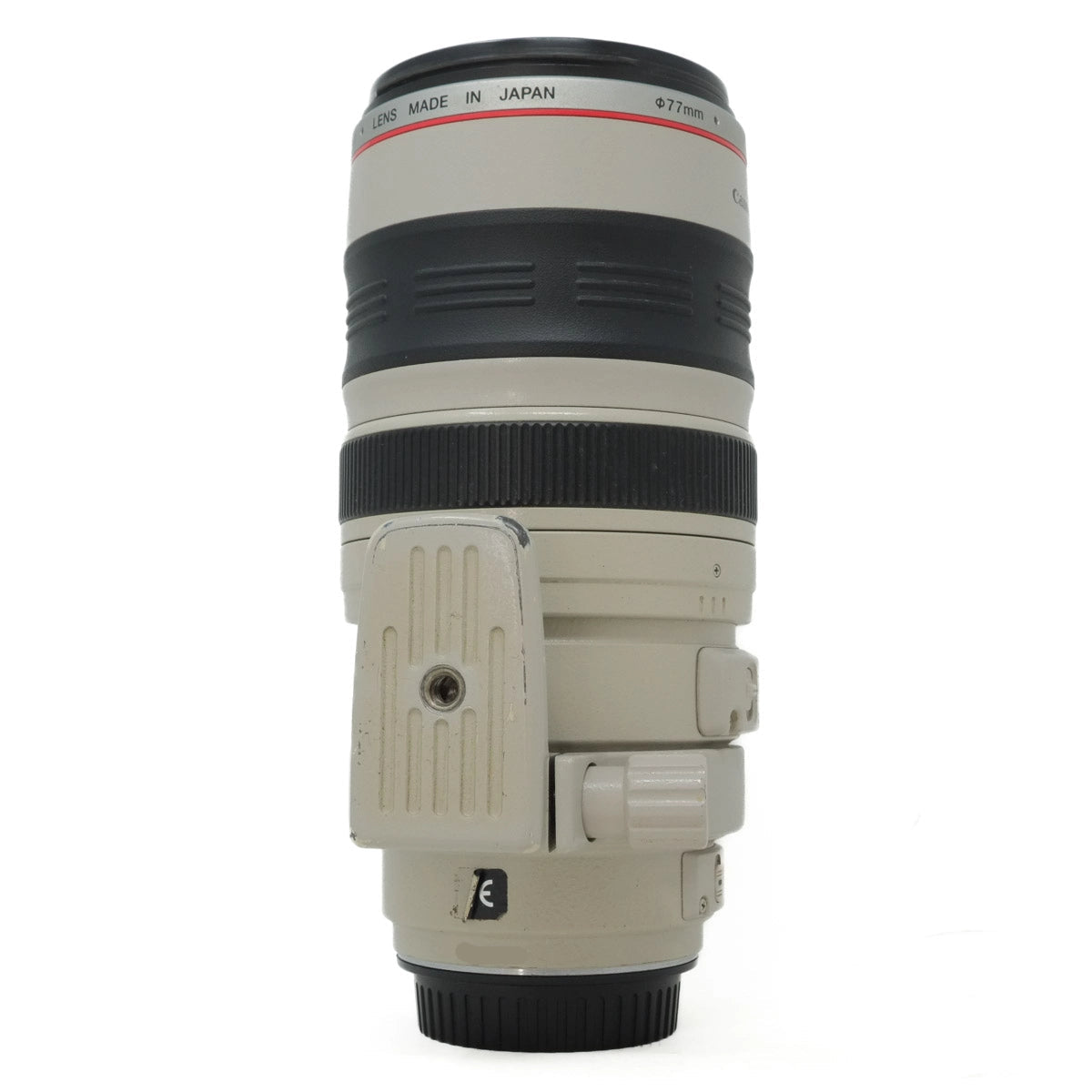Camera lens with 'Made in Japan' text on a white background