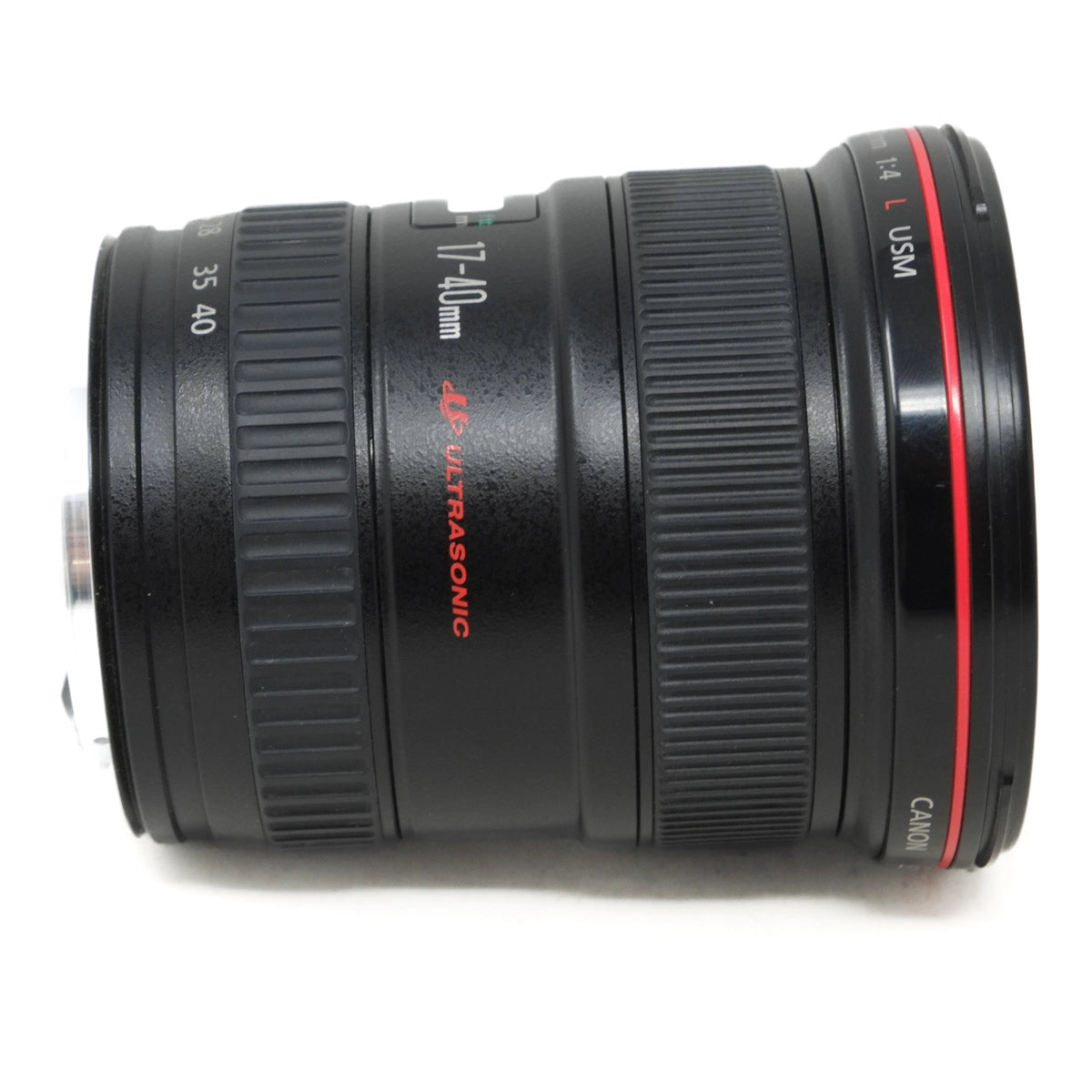 Camera lens with 'Canon' branding on a white background