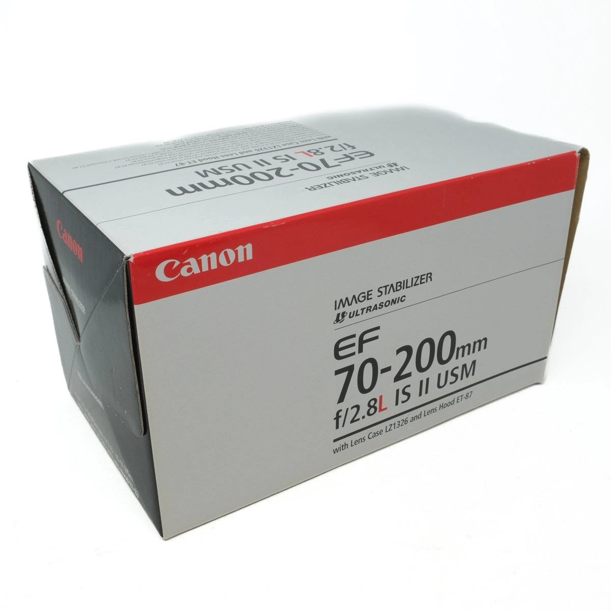 Canon camera lens box with specifications on a white background