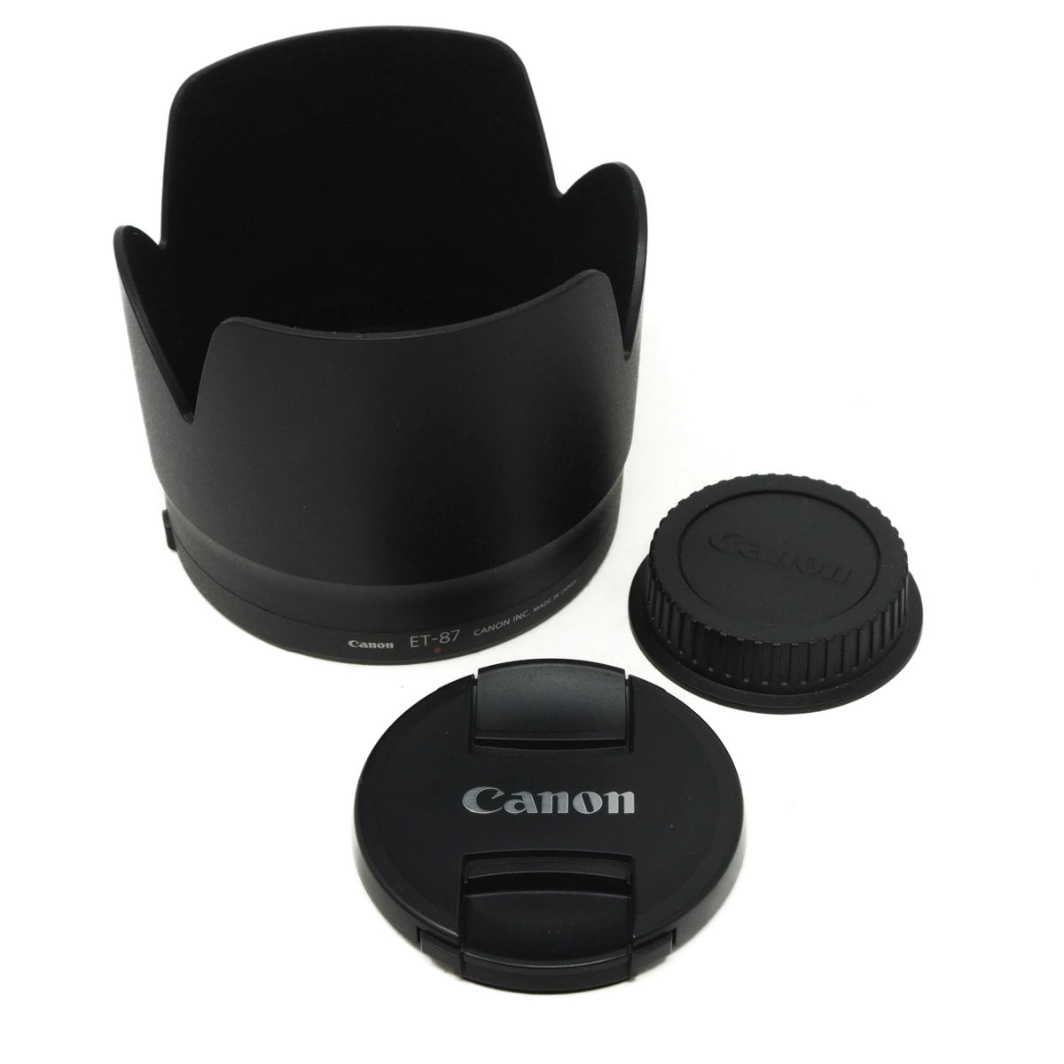 Canon lens hood and lens caps on a white background