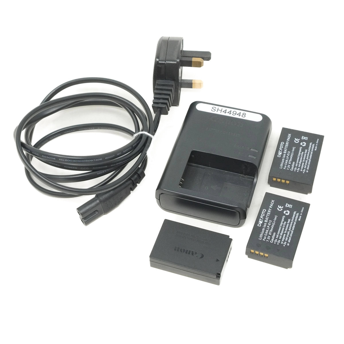 Camera battery and charger set on a white background