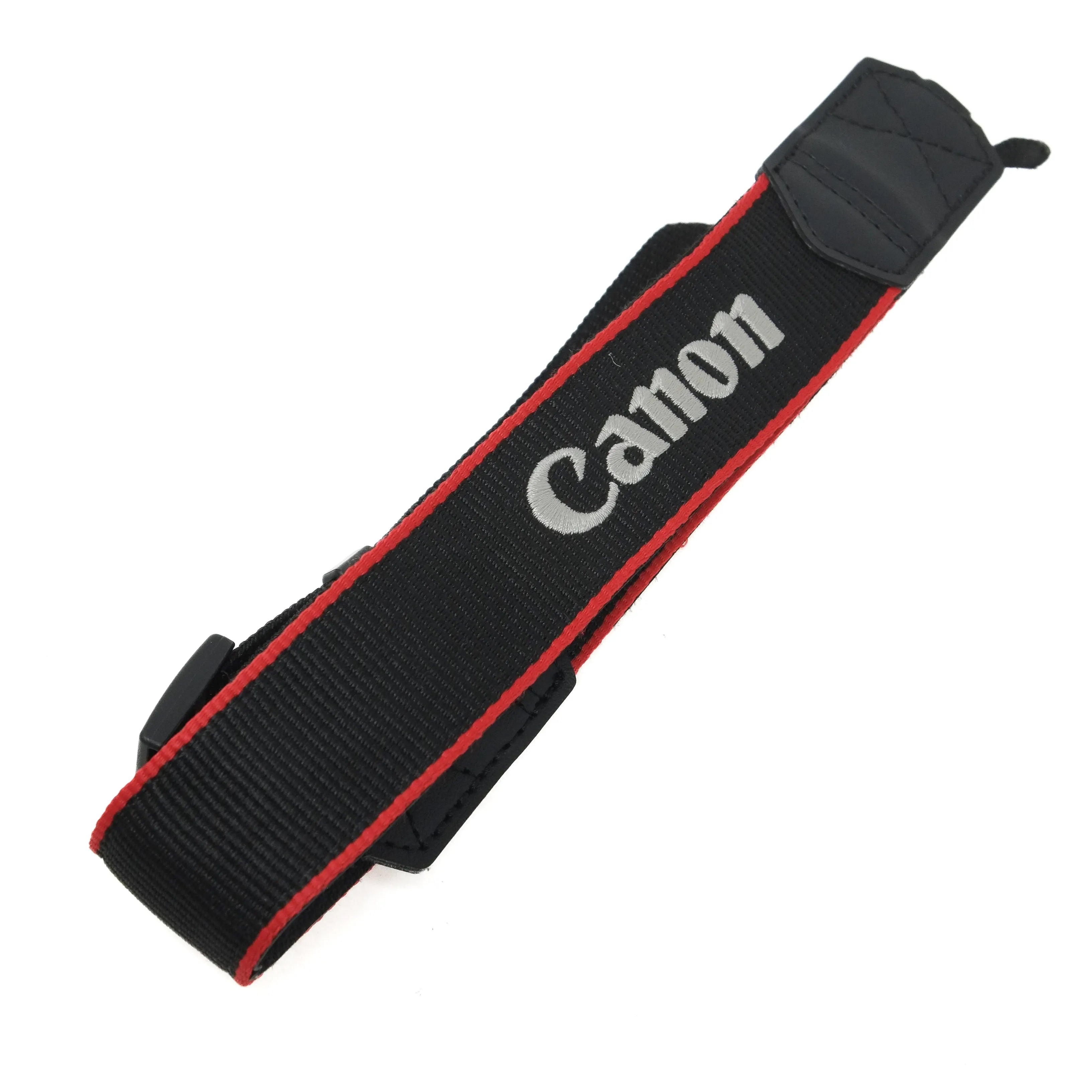 Black camera strap with 'Canon' logo on a white background