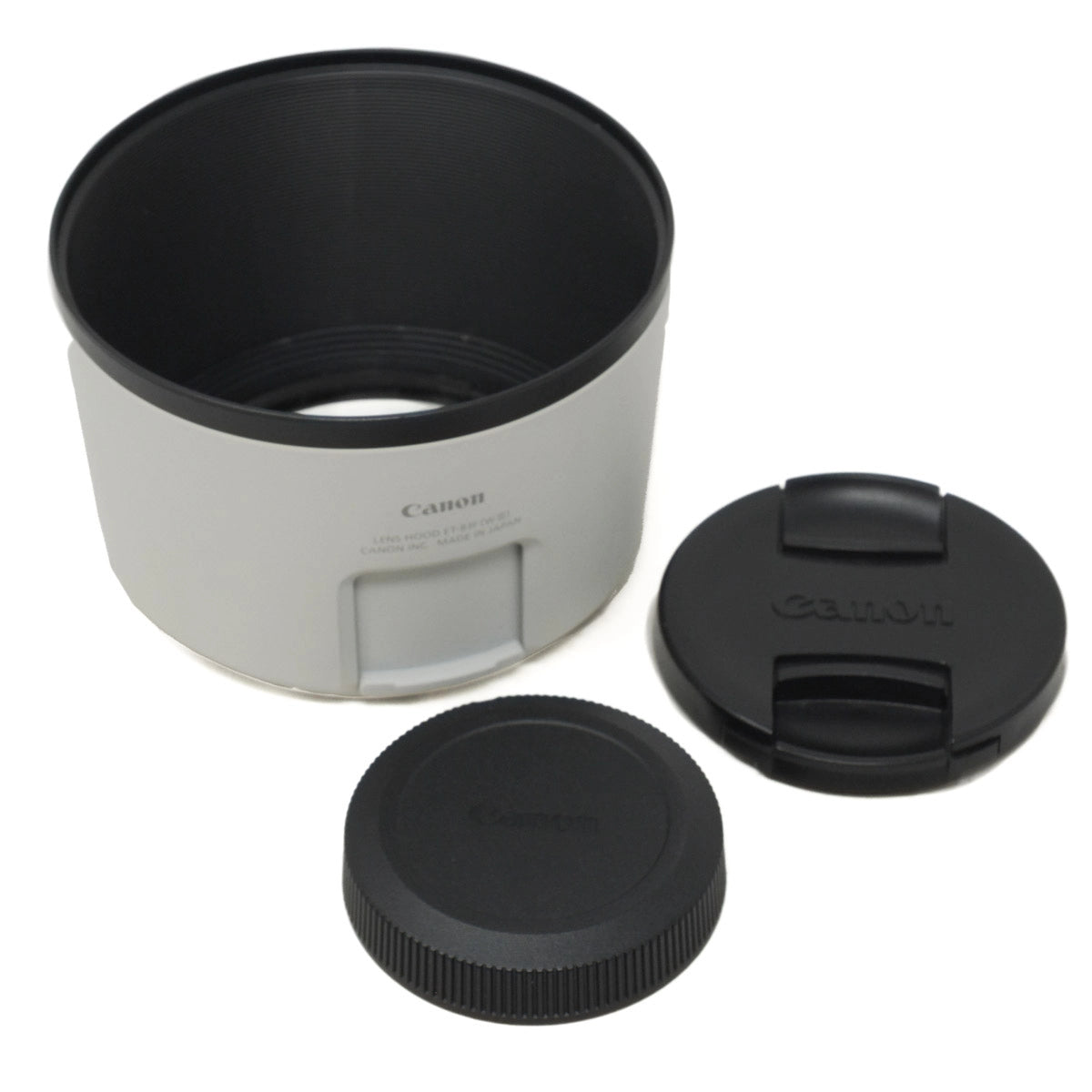 Canon lens hood and lens caps on a white background