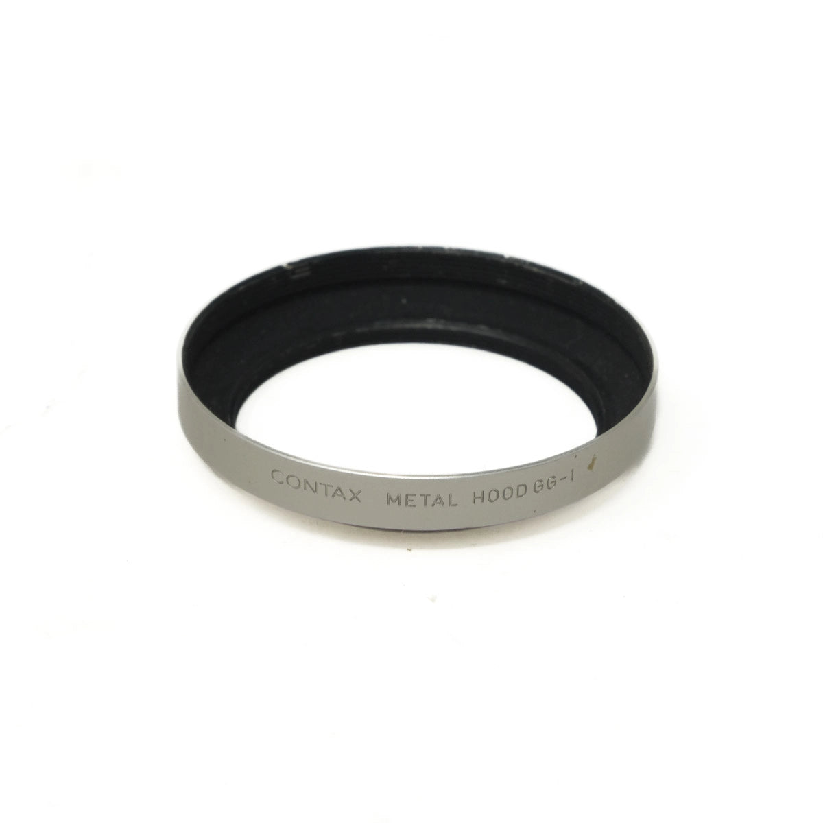 Black metal lens hood with 'Contax' branding on a white background