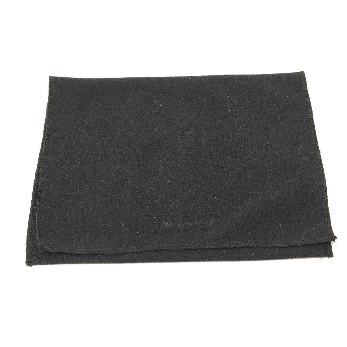 Folded black fabric on a white background