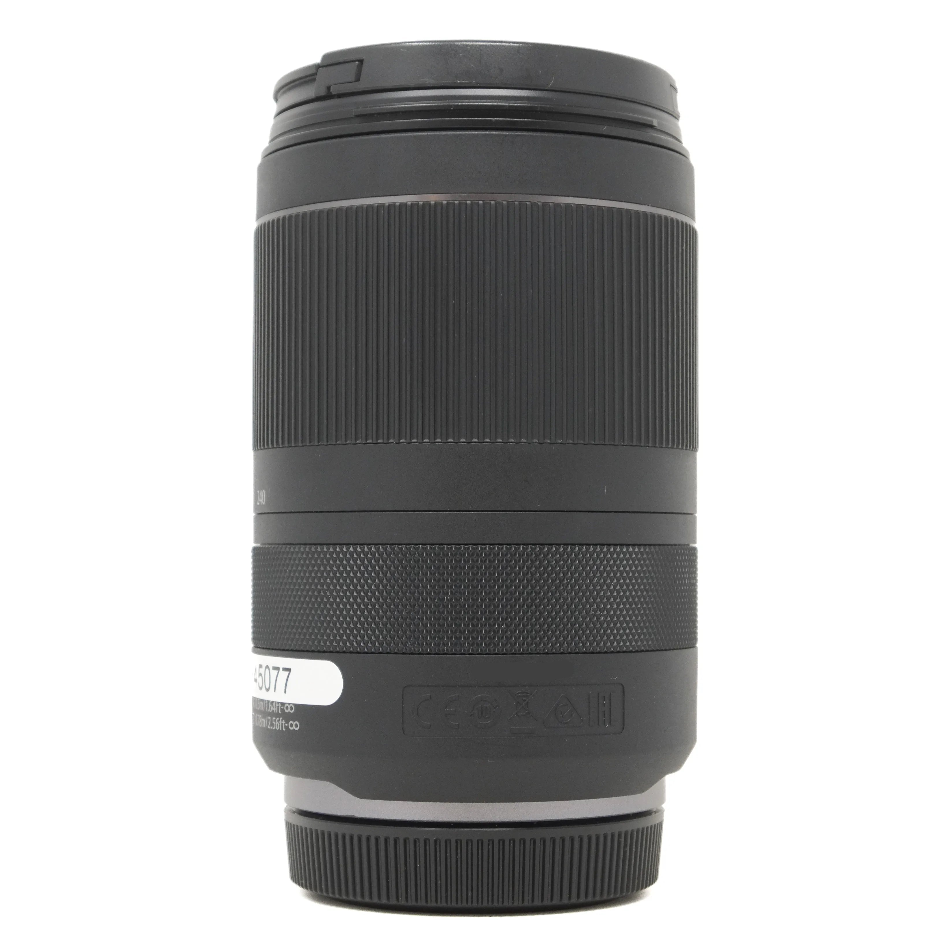Black camera lens on a white background