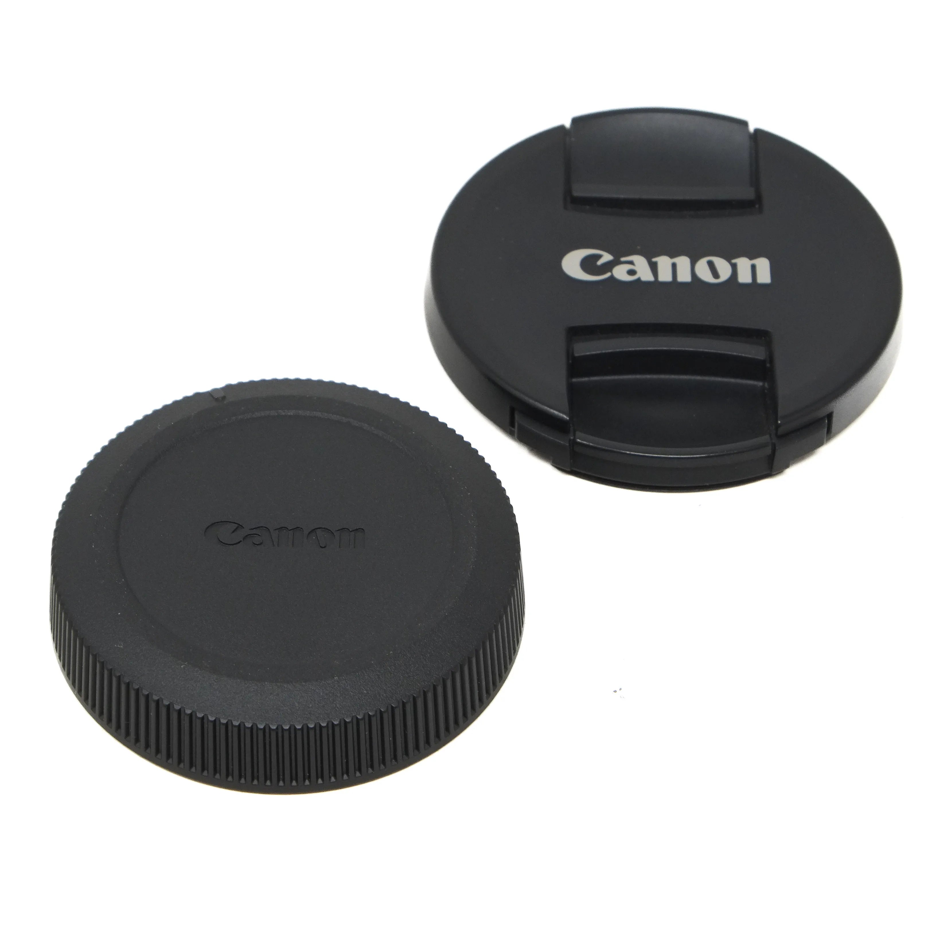 Canon lens caps on a white background