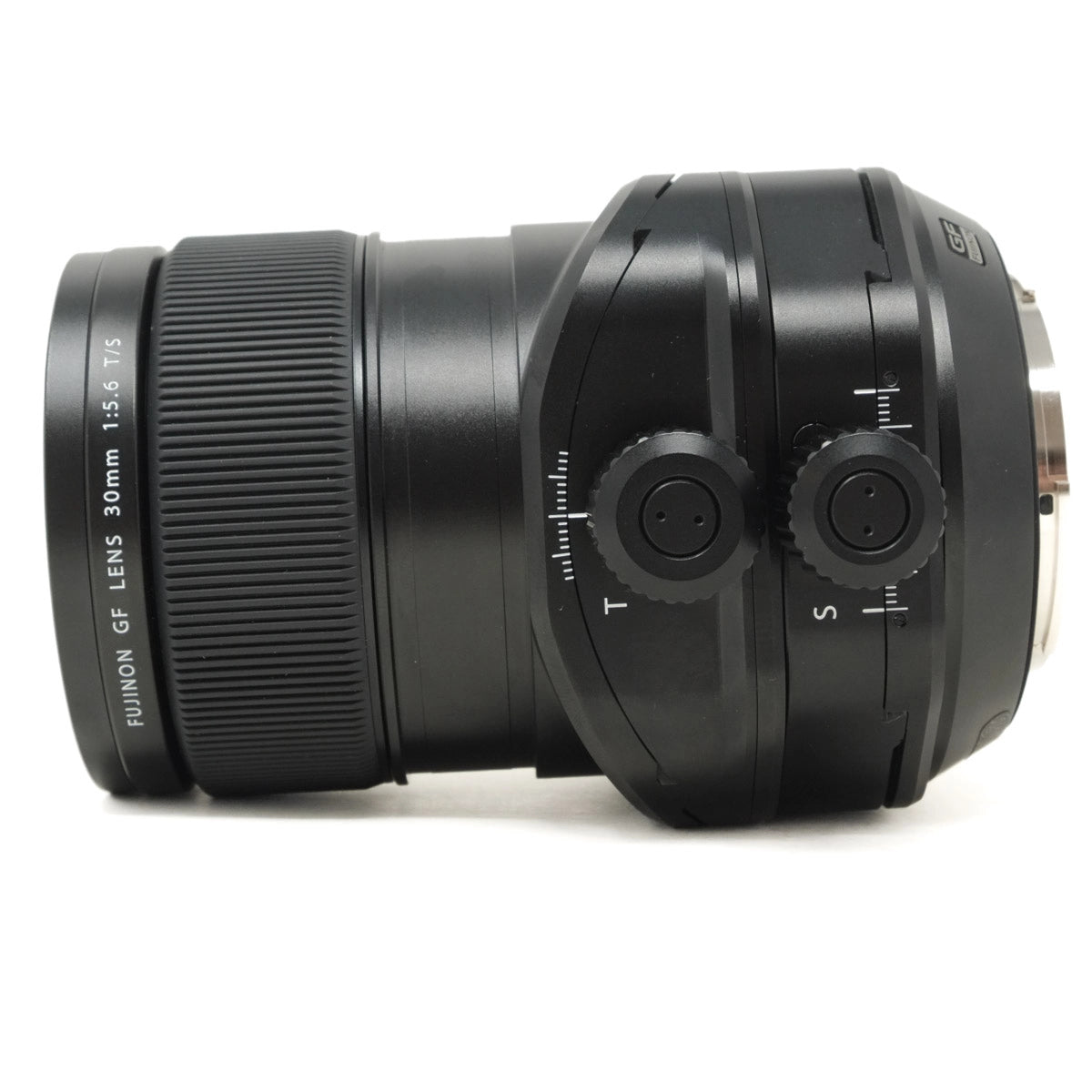 Black camera lens with control knobs on a white background