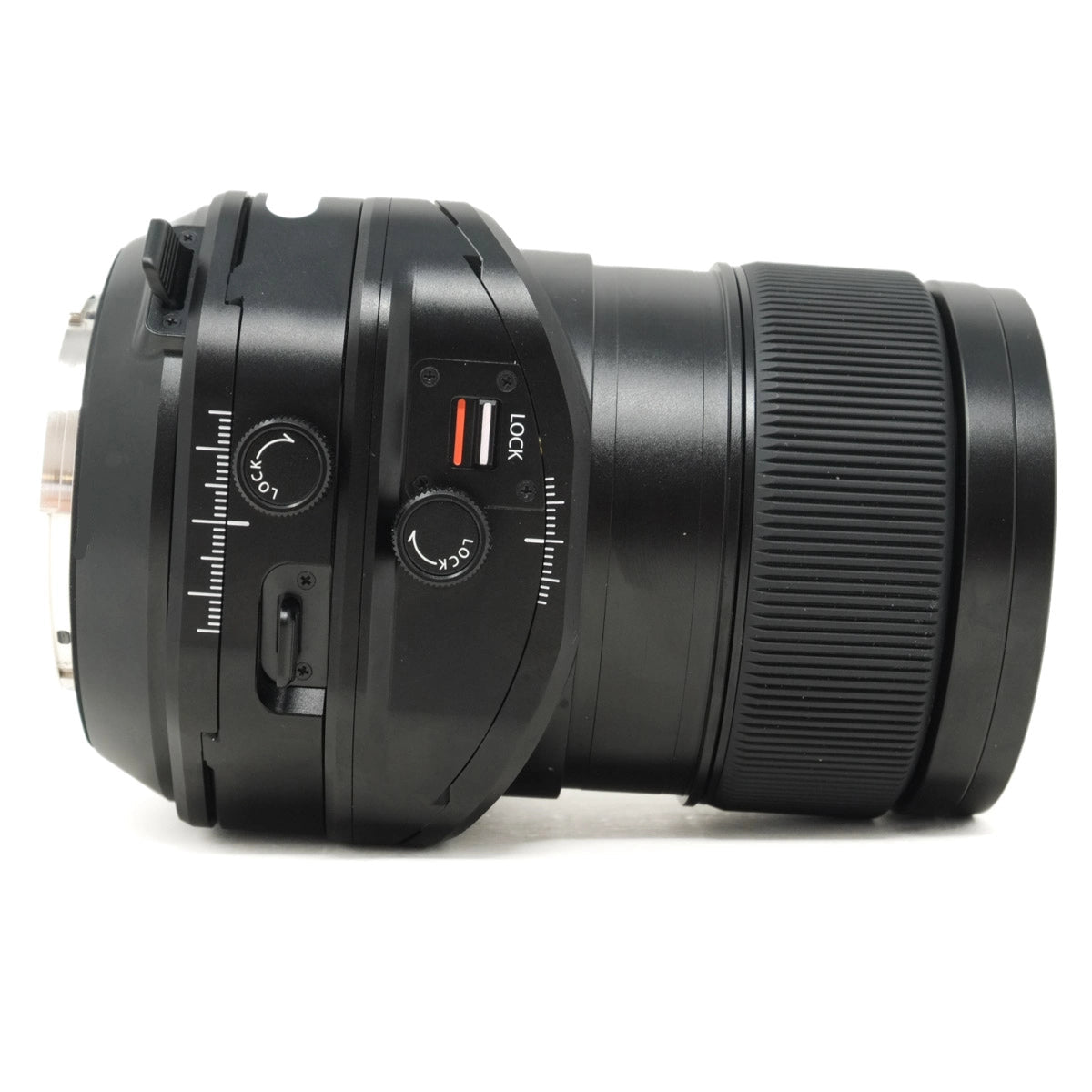 Black camera lens with control rings on a white background