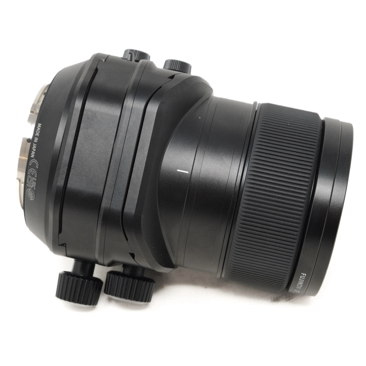 Black camera lens on a white background