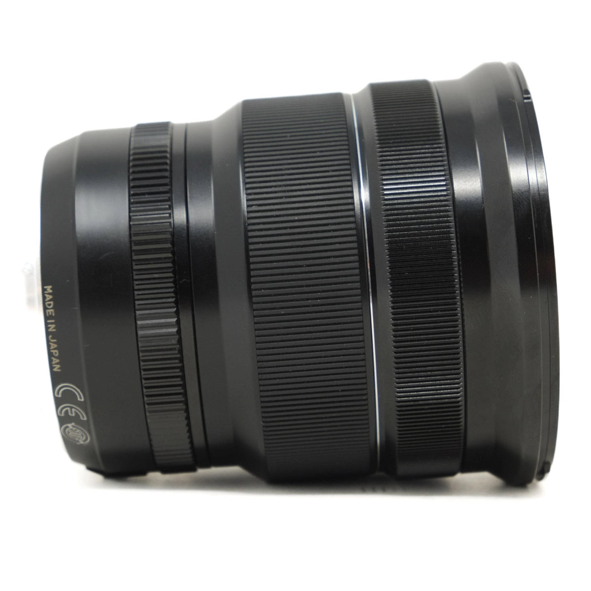 Black camera lens on a white background