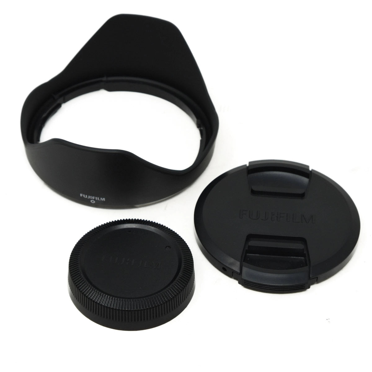 Set of Fujifilm camera lens accessories on a white background