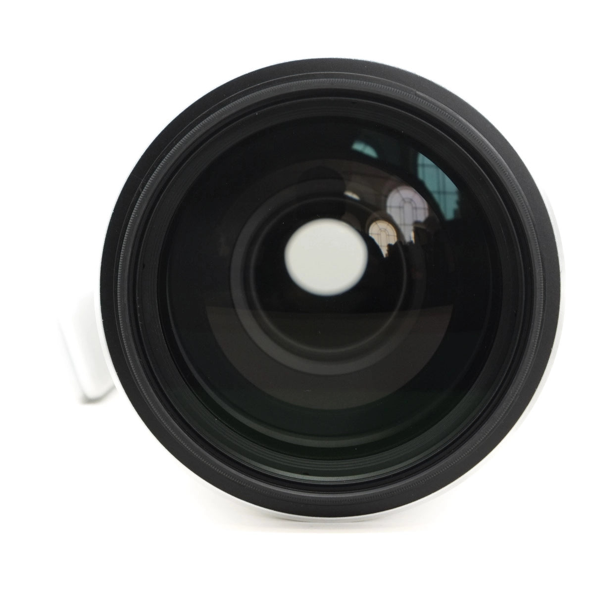 Black camera lens on a white background