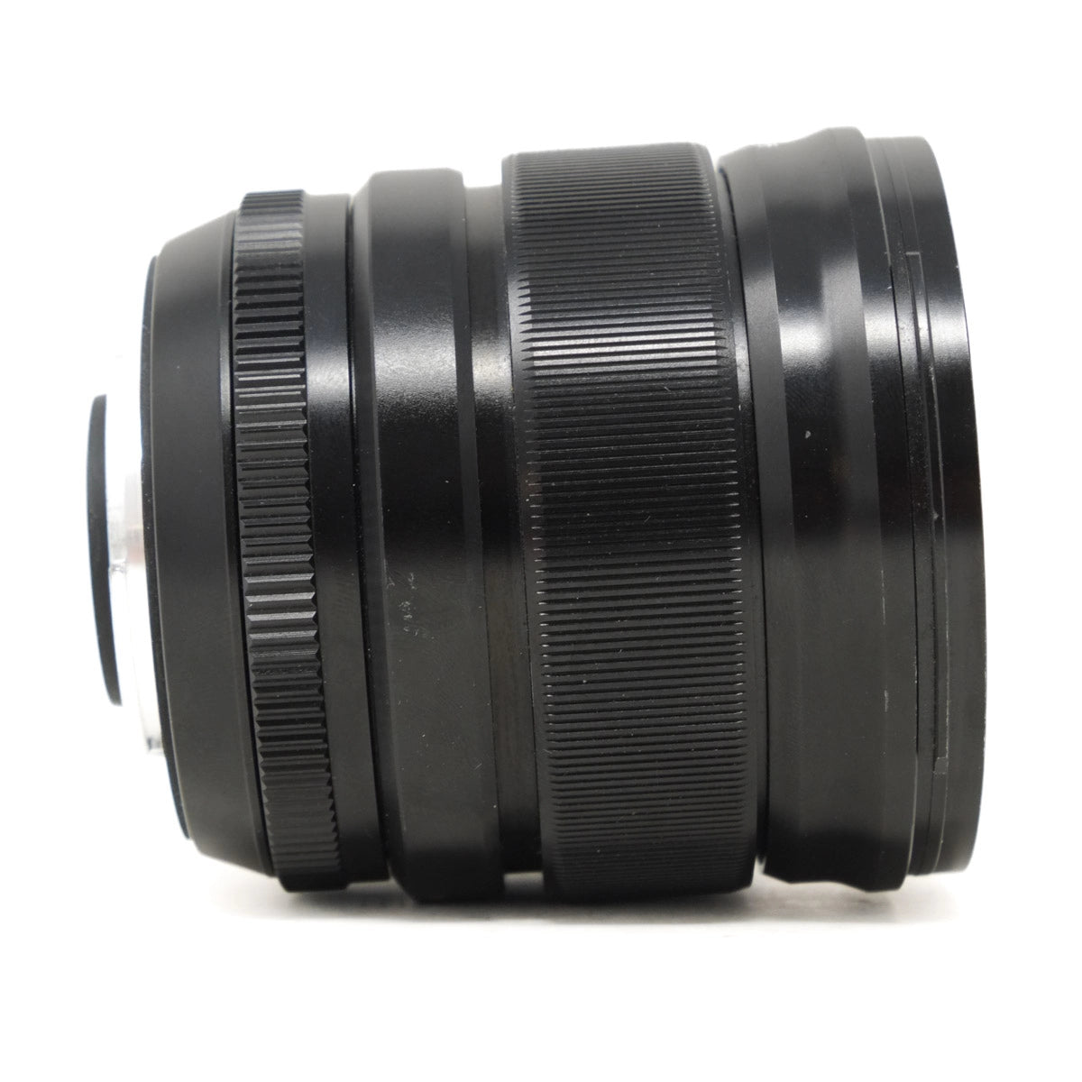 Black camera lens on a white background