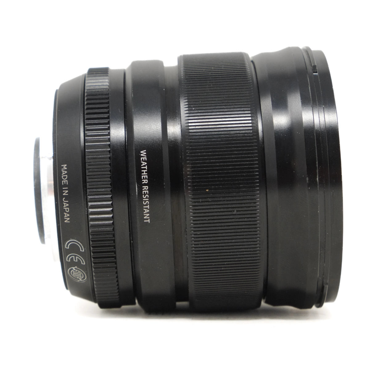 Black camera lens with 'Made in Japan' and 'Weather Resistant' text on a white background